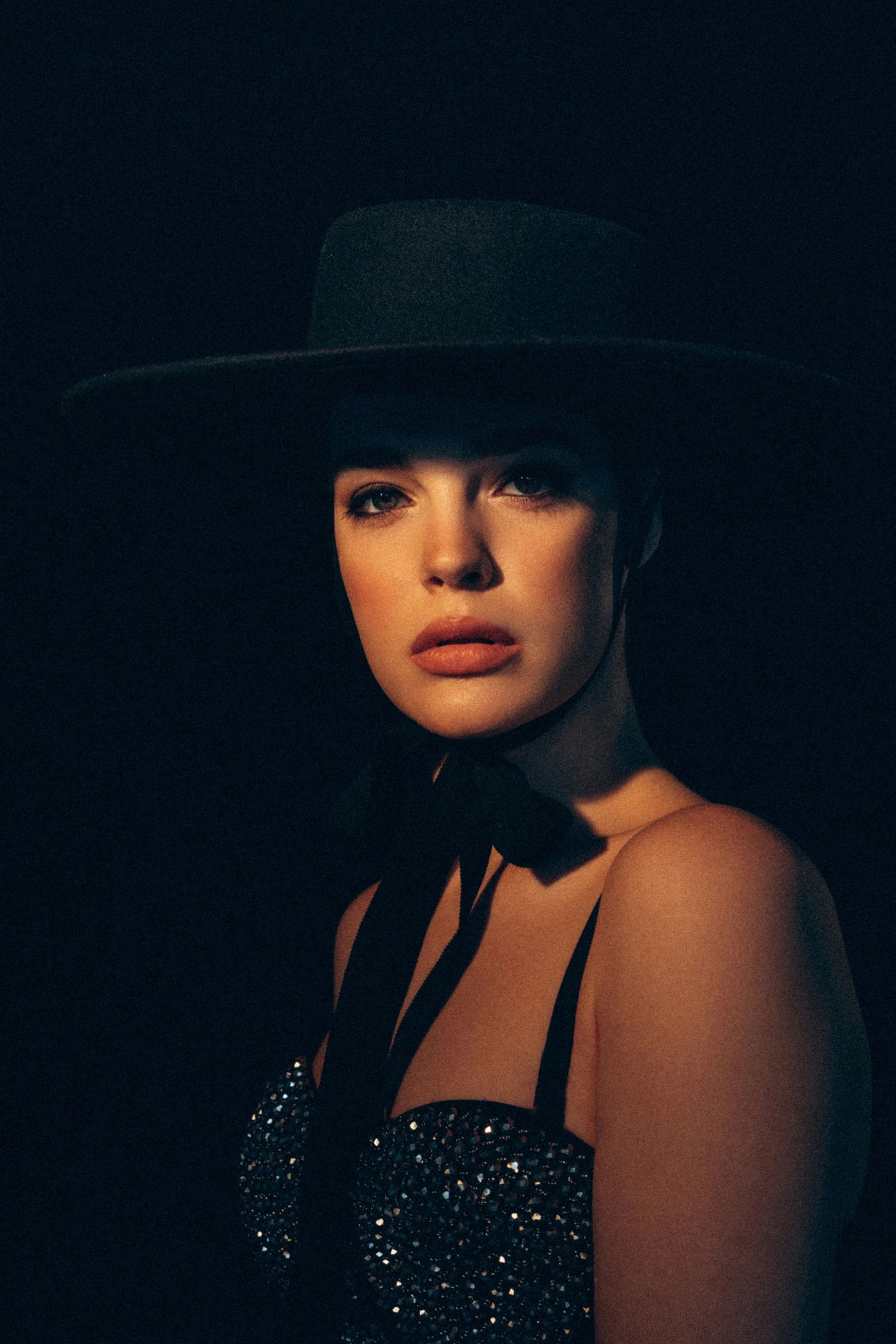 Luxury fashion model wearing a retro designer hat